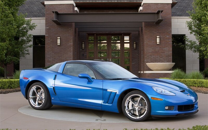 Blue Corvette in front of house