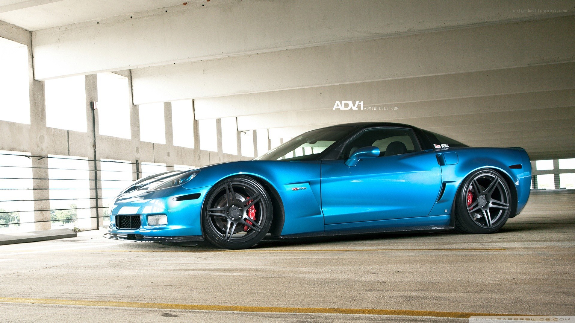 blue corvette in parking garage