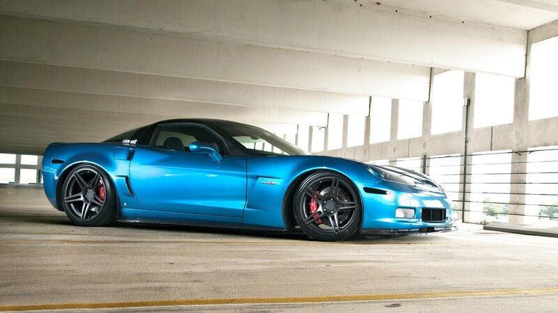 blue corvette in parking garage