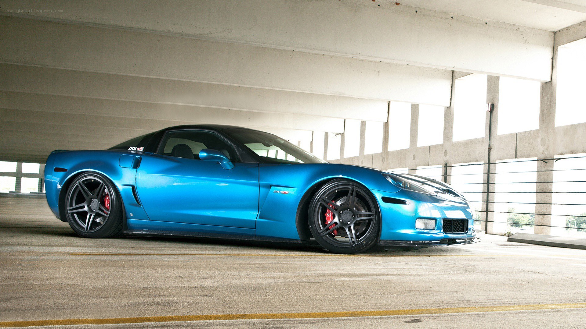 blue corvette in parking garage