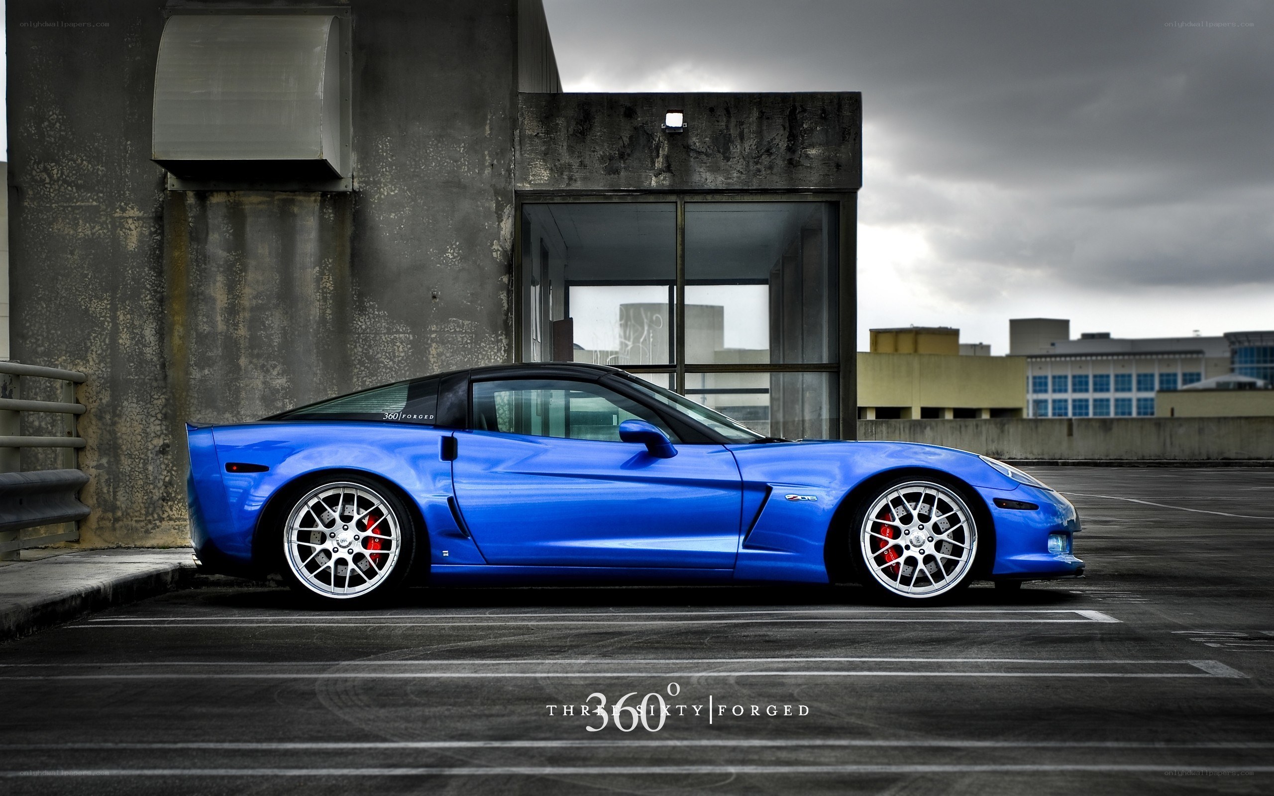 blue corvette in parking lot