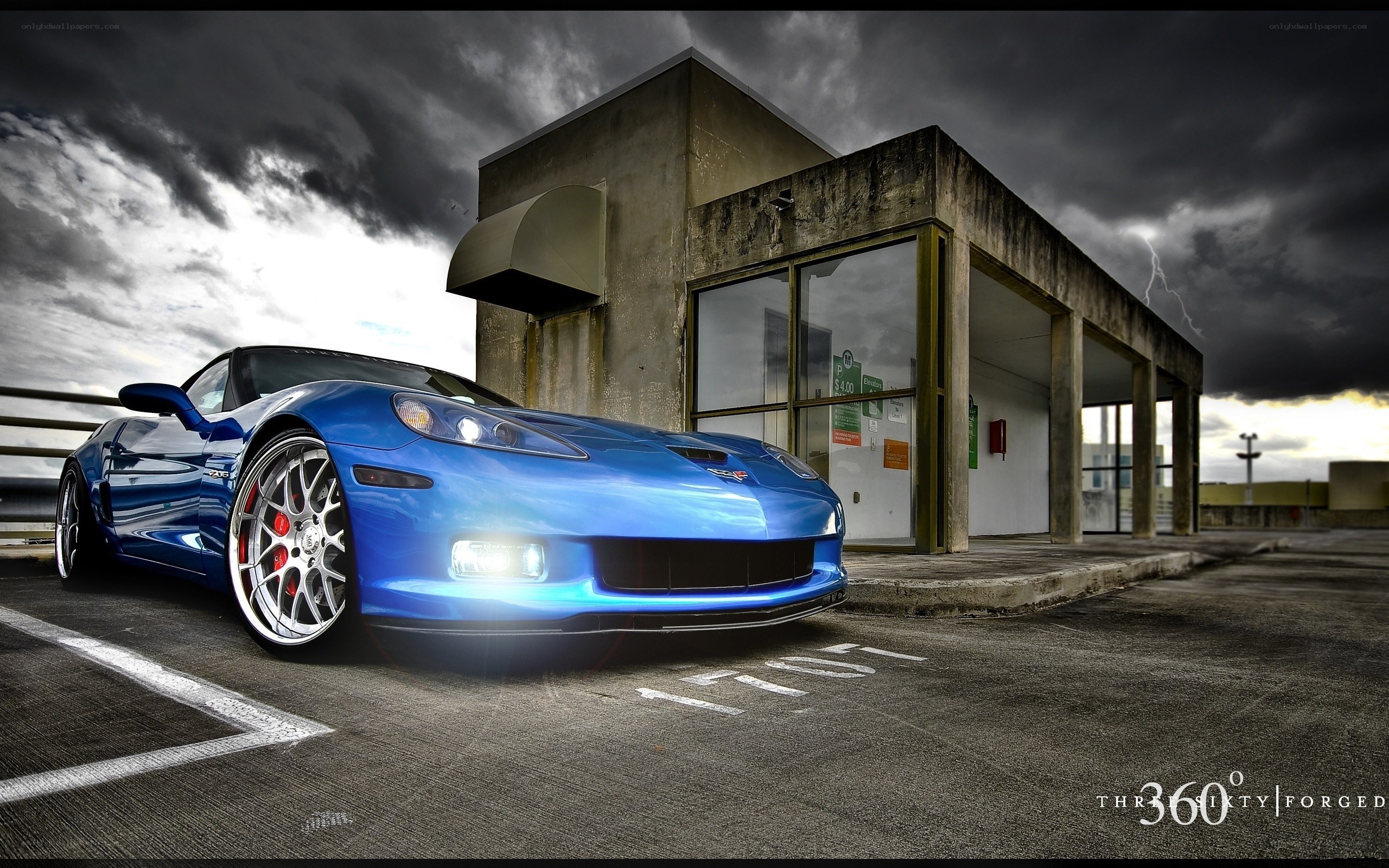 Blue Corvette in stormy parking lot