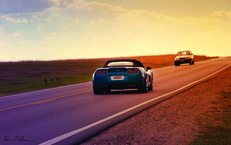 Blue Corvette on a country road