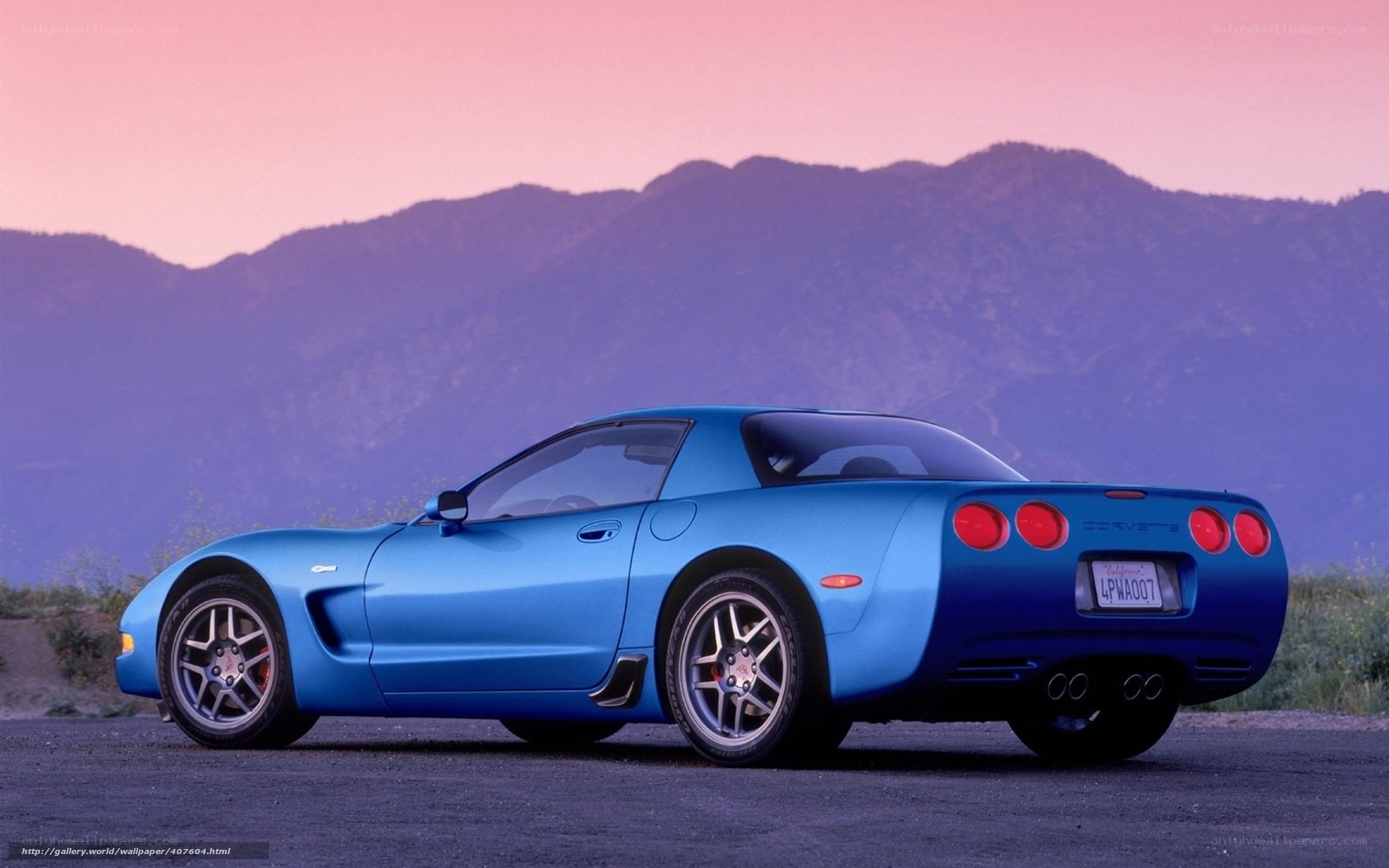 Blue Corvette on a mountain road