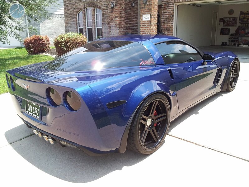 Blue Corvette parked in driveway