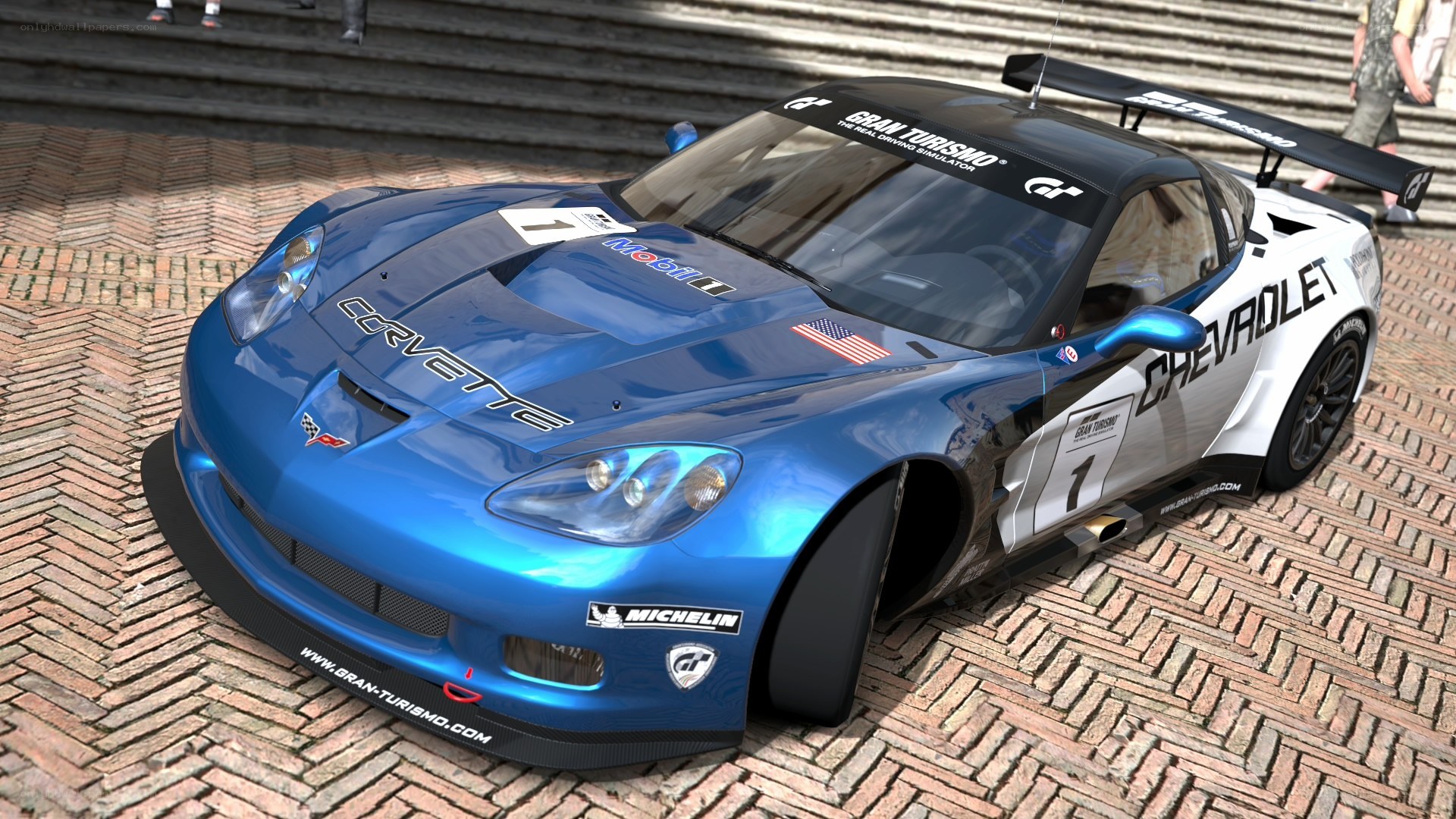 Blue Corvette race car on bricks