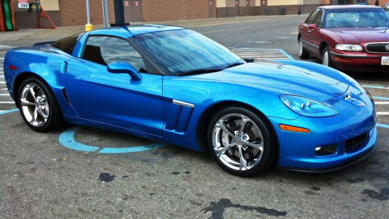 Blue Corvette Sports Car — Calm, Afternoon, Photograph, Parking Lot, Red Sedan