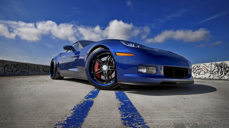 Blue Corvette Sports Car — Dramatic, Afternoon, Photograph, Concrete Surface