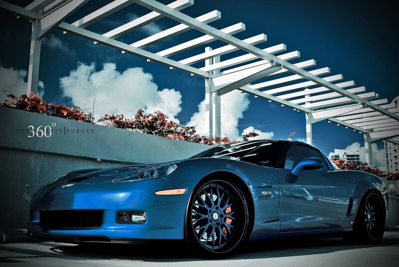 Blue Corvette under a pergola