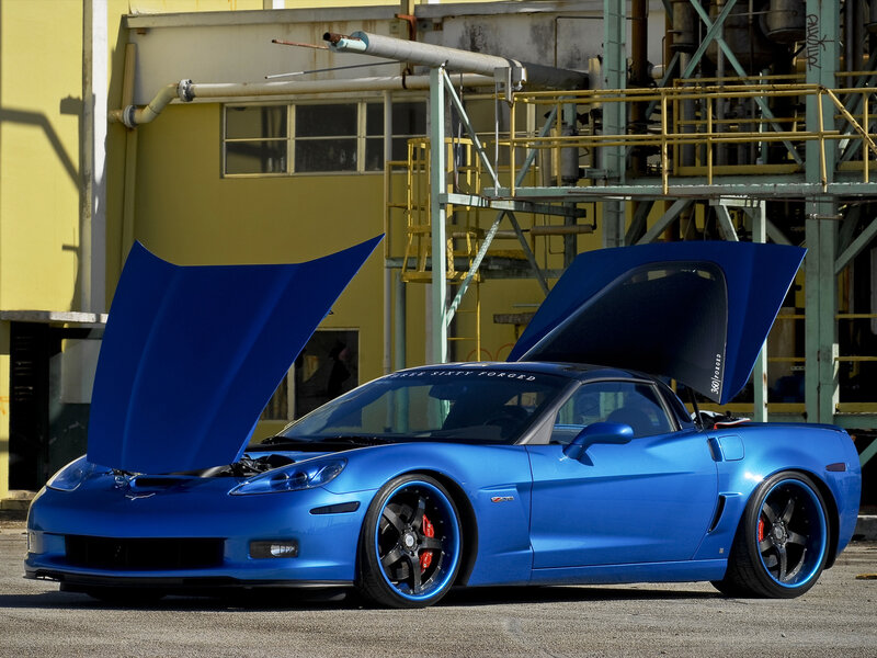 Blue Corvette with open doors