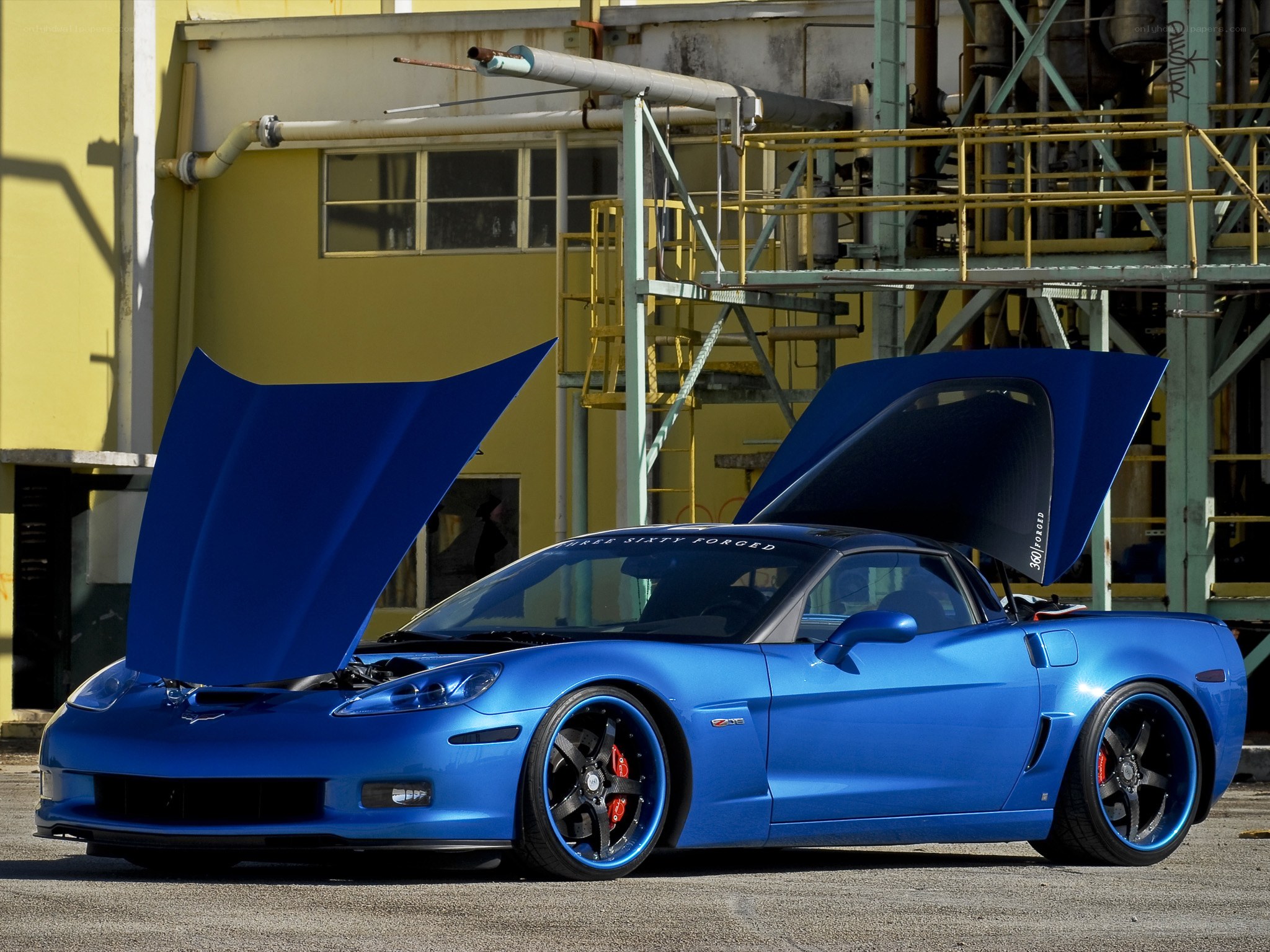Blue Corvette with open doors