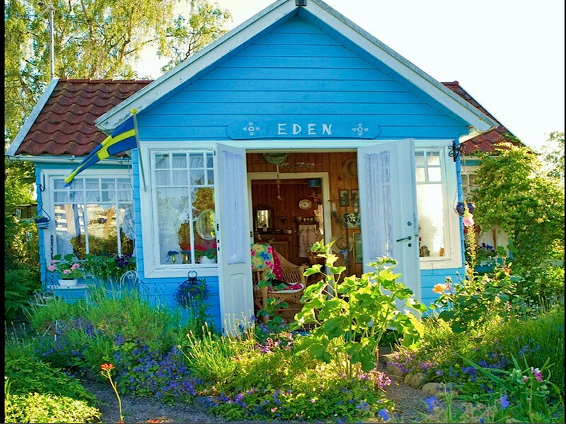 Blue Cottage in Garden — Serene