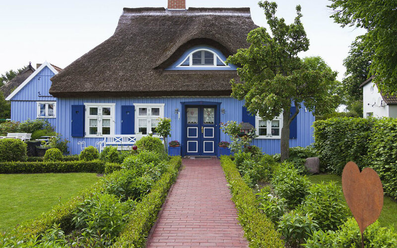Blue Cottage with Thatched Roof — Serene