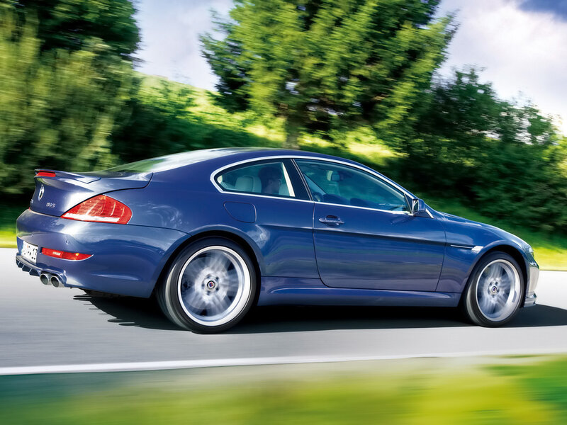 blue coupe in motion