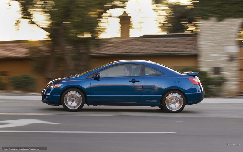blue coupe in motion