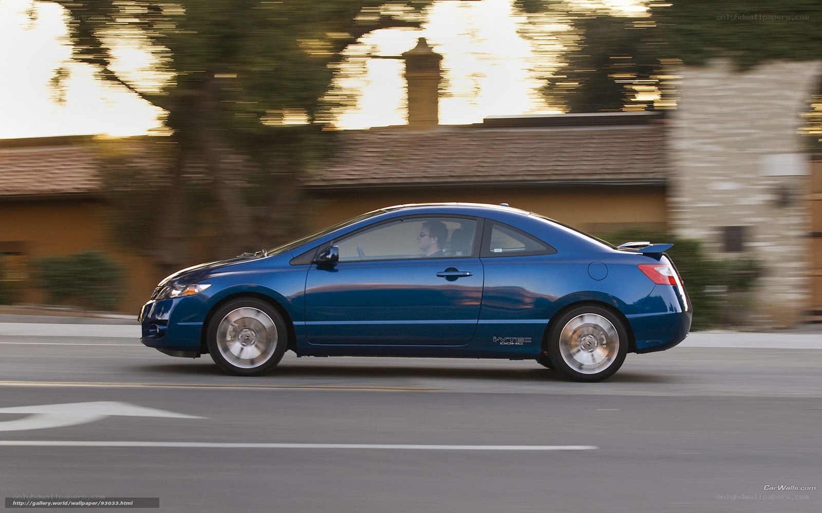 blue coupe in motion
