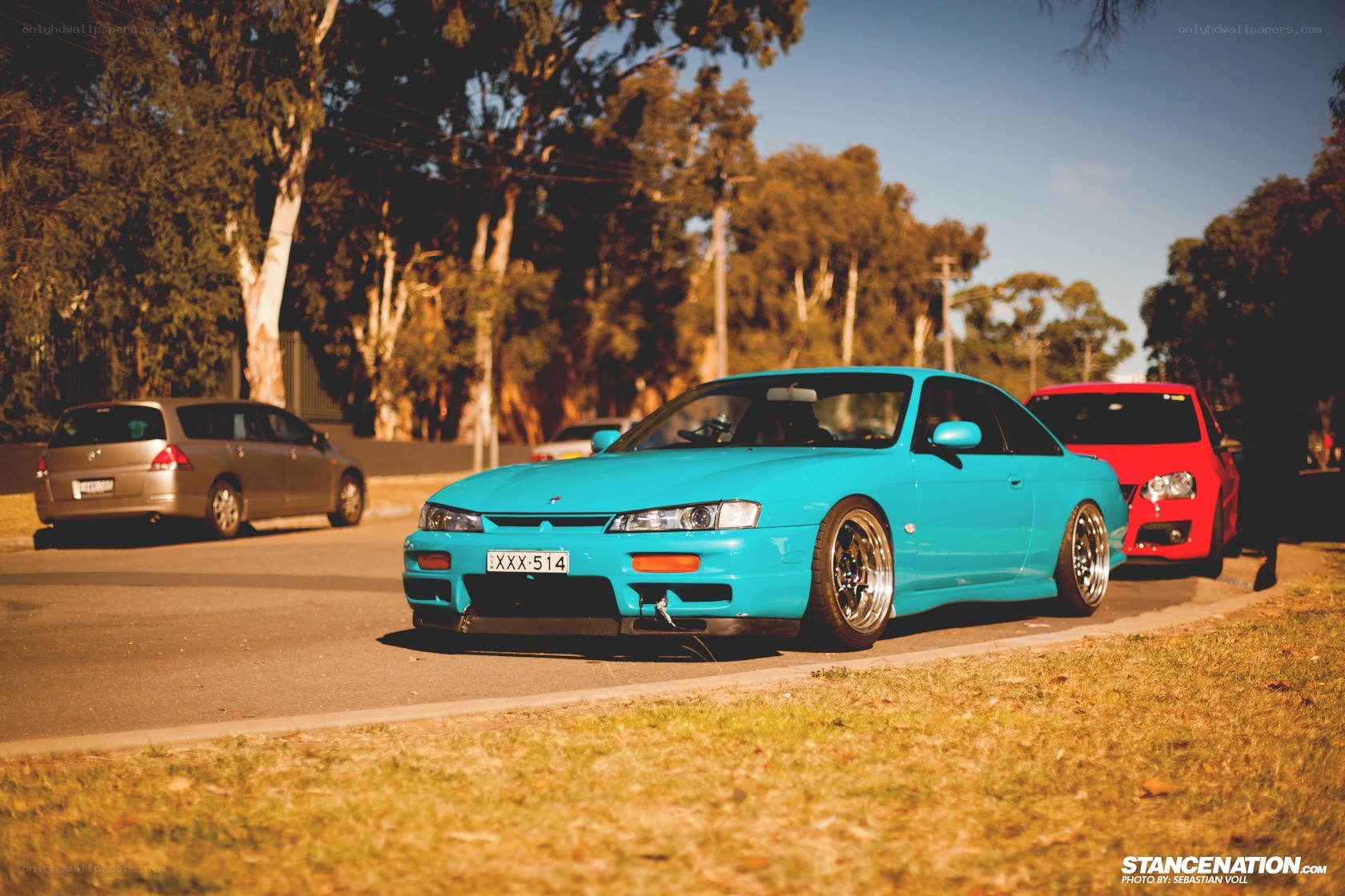 blue coupe on a street