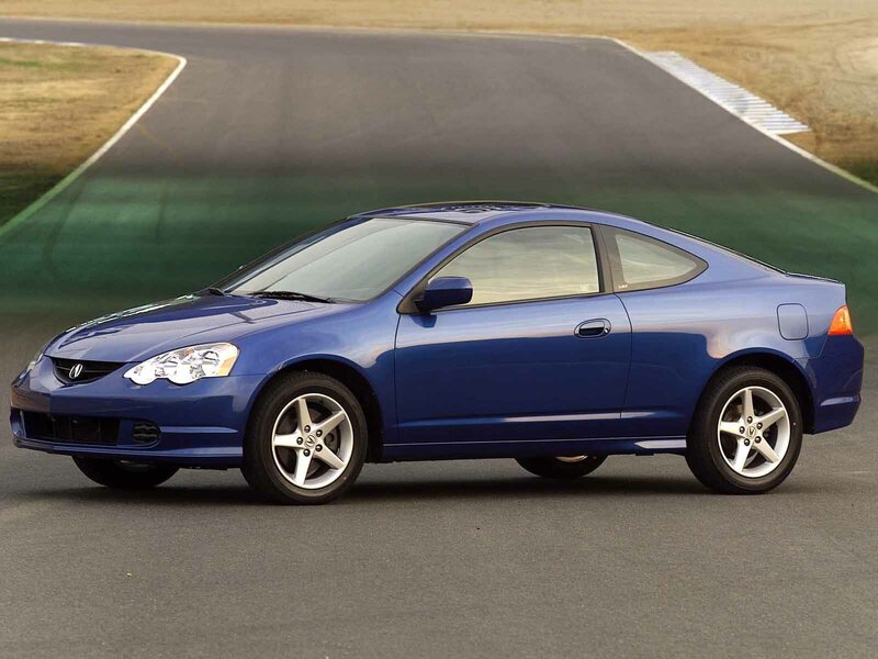 blue coupe on racetrack