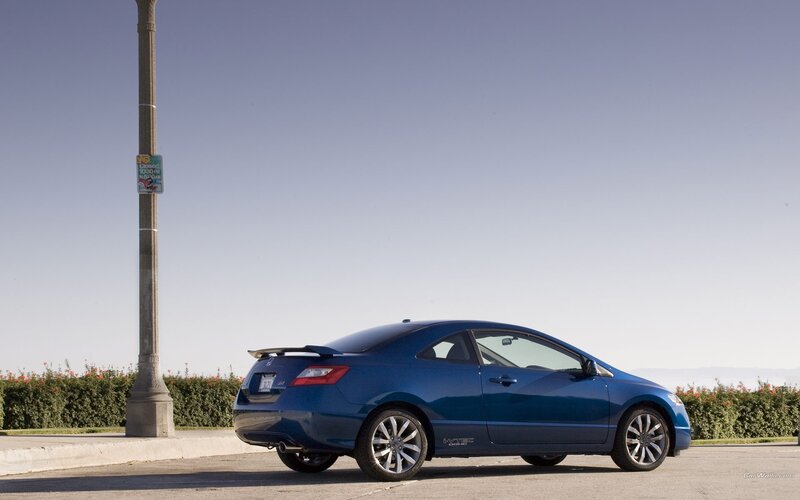 blue coupe parked on street