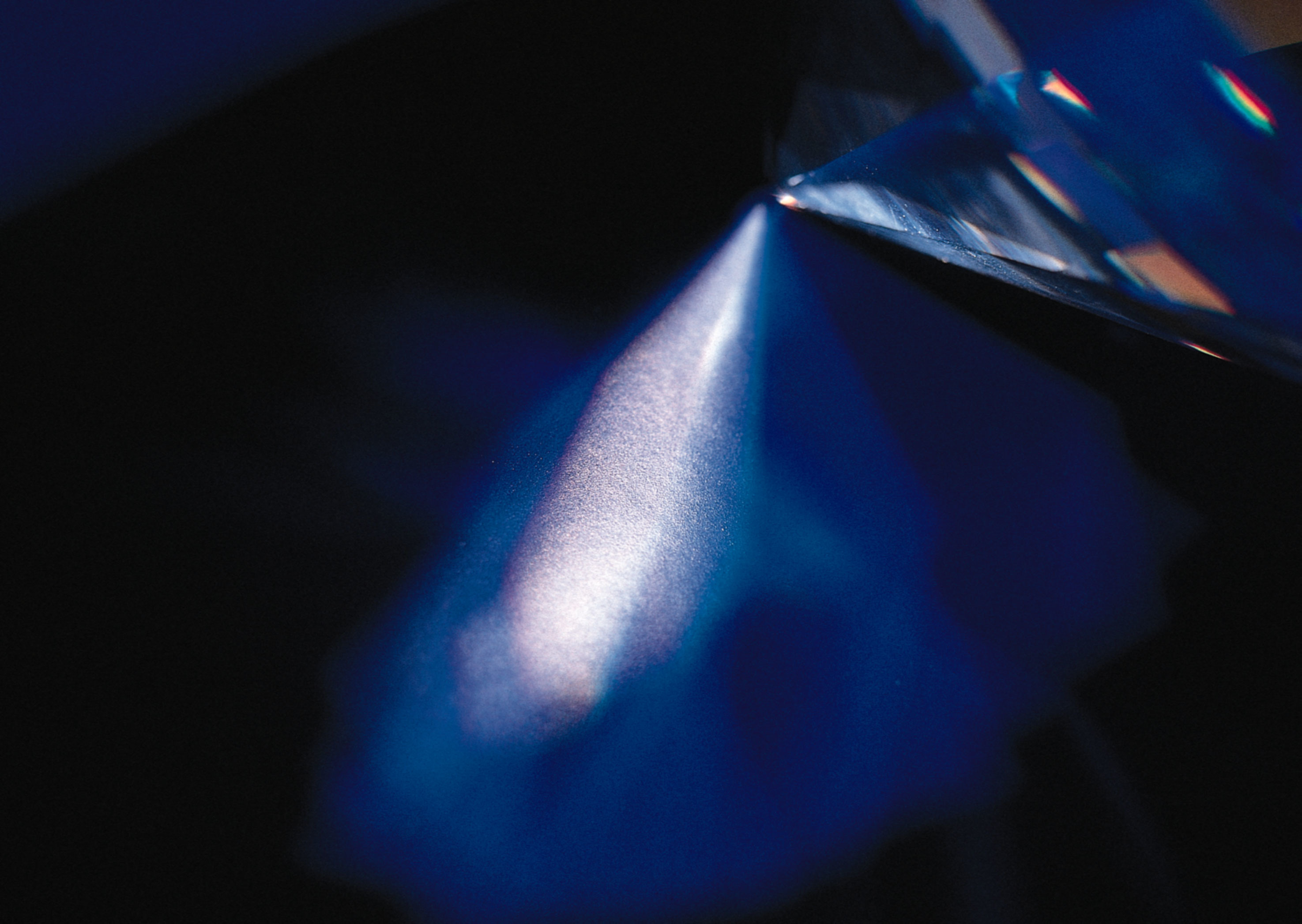 Blue crystal prism refracting light