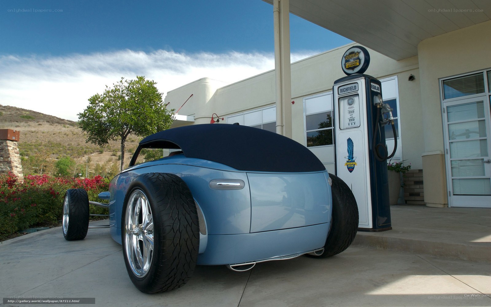 Blue custom car at gas station