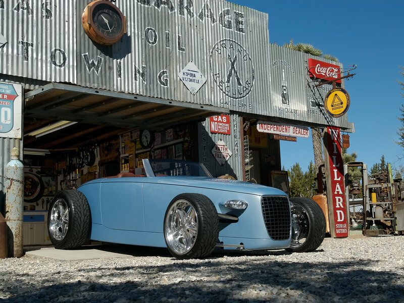 Blue custom car at vintage garage