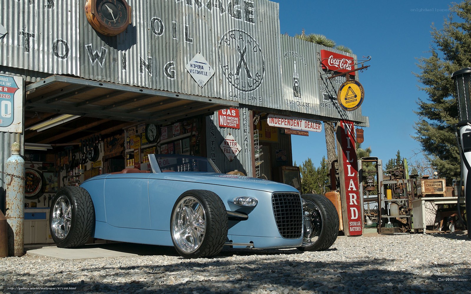 Blue custom car at vintage gas station