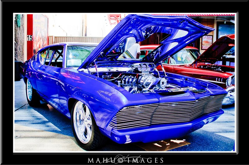 Blue custom car with open hood