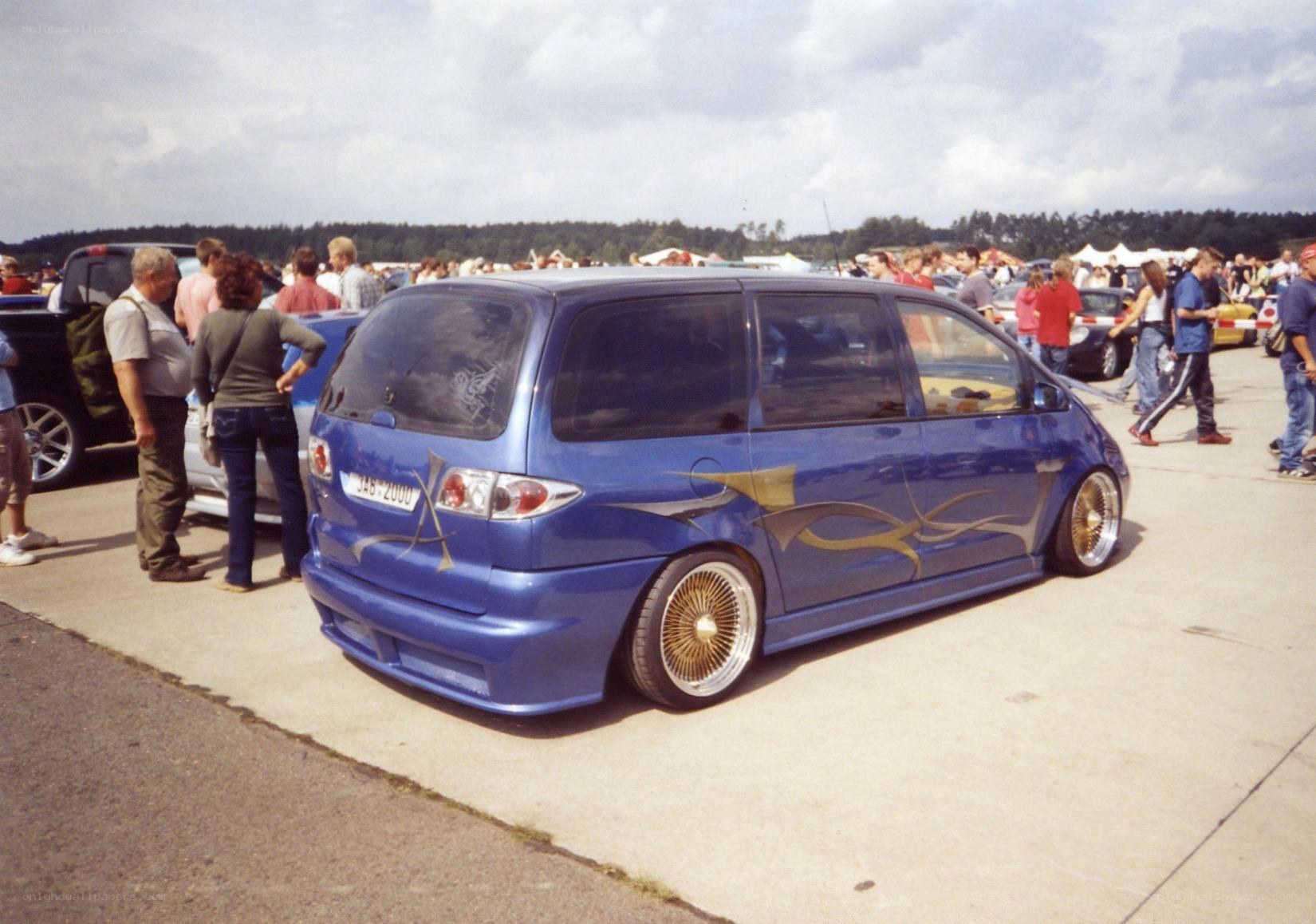 Blue custom minivan at car show