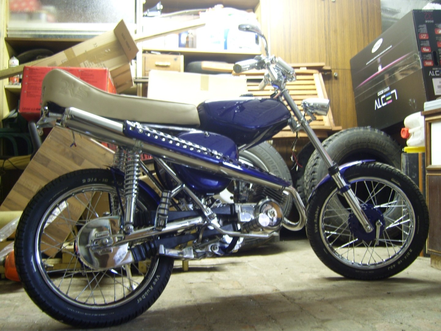 blue custom motorcycle in garage