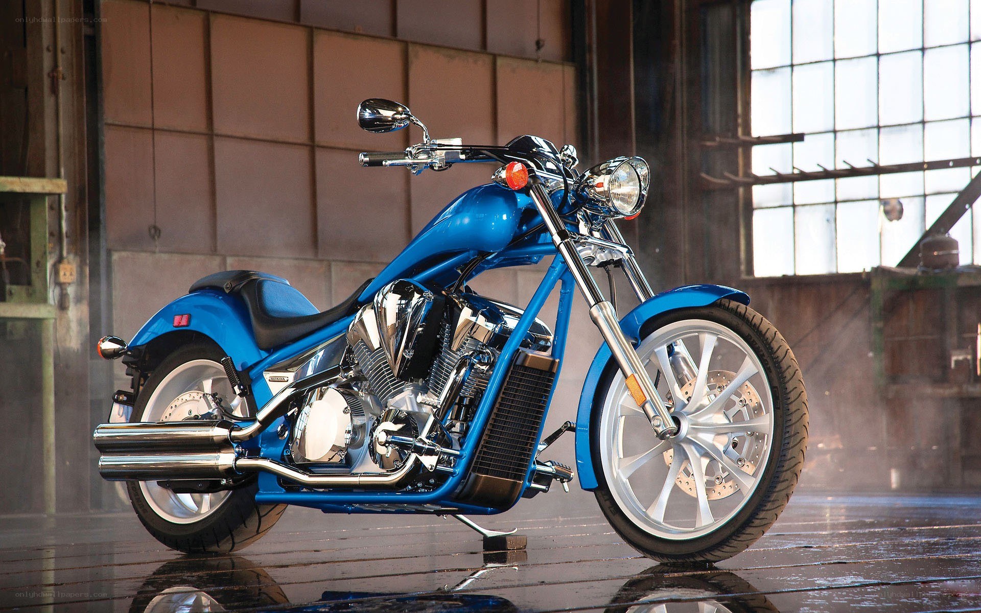 Blue custom motorcycle in warehouse