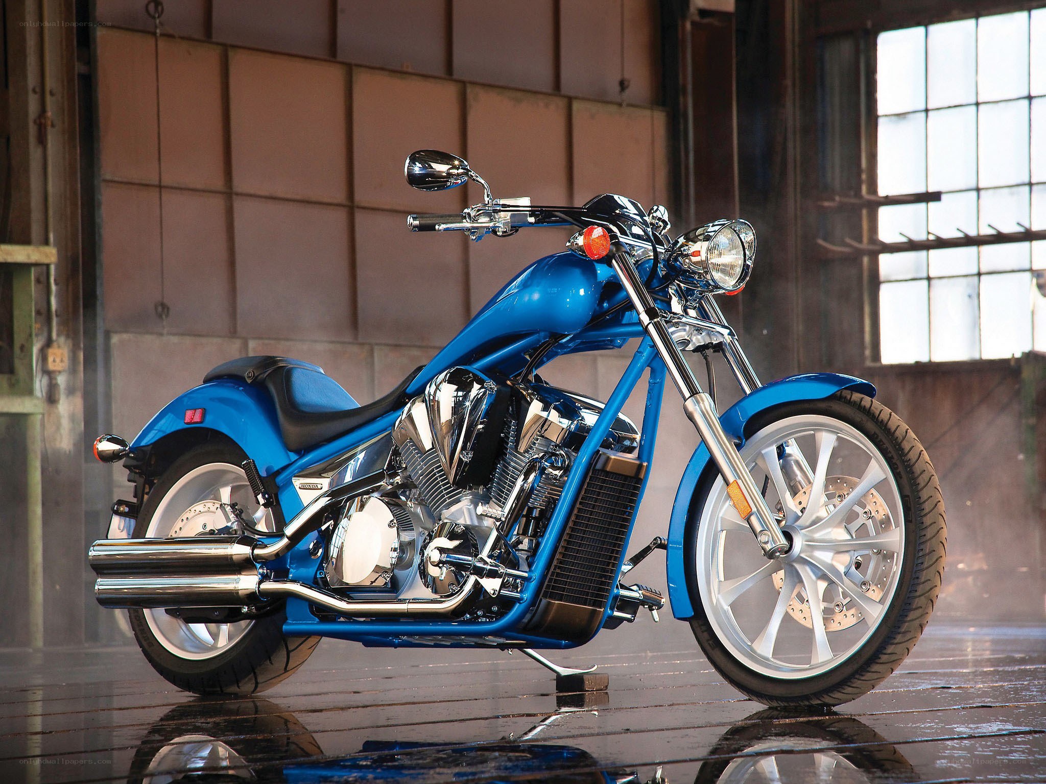 Blue custom motorcycle in warehouse