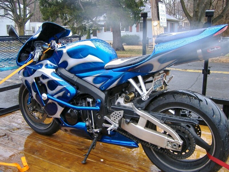 blue custom motorcycle on trailer