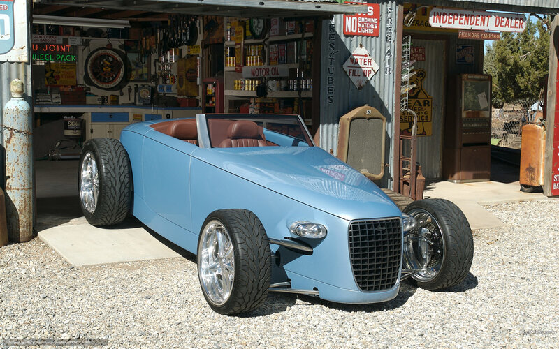 Blue custom roadster in garage
