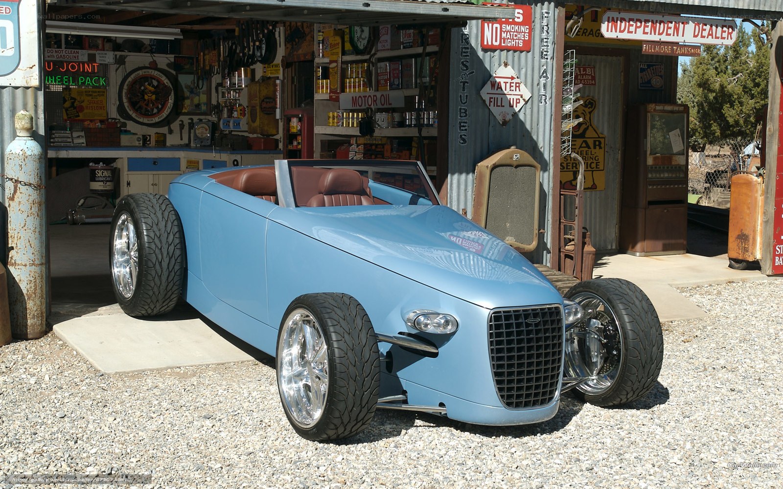 Blue custom roadster in garage
