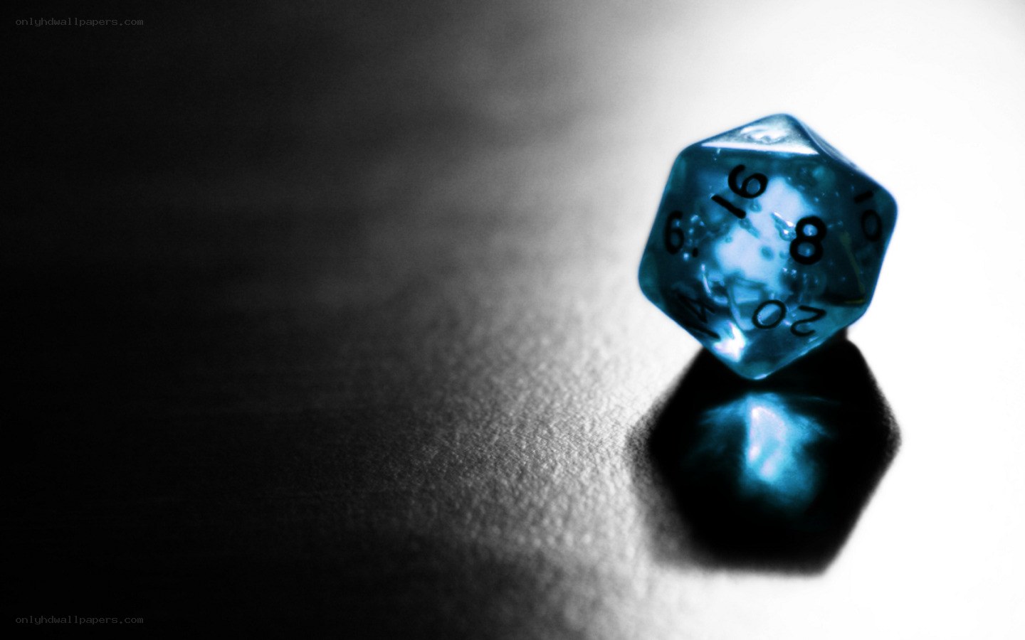 Blue d20 dice on dark surface