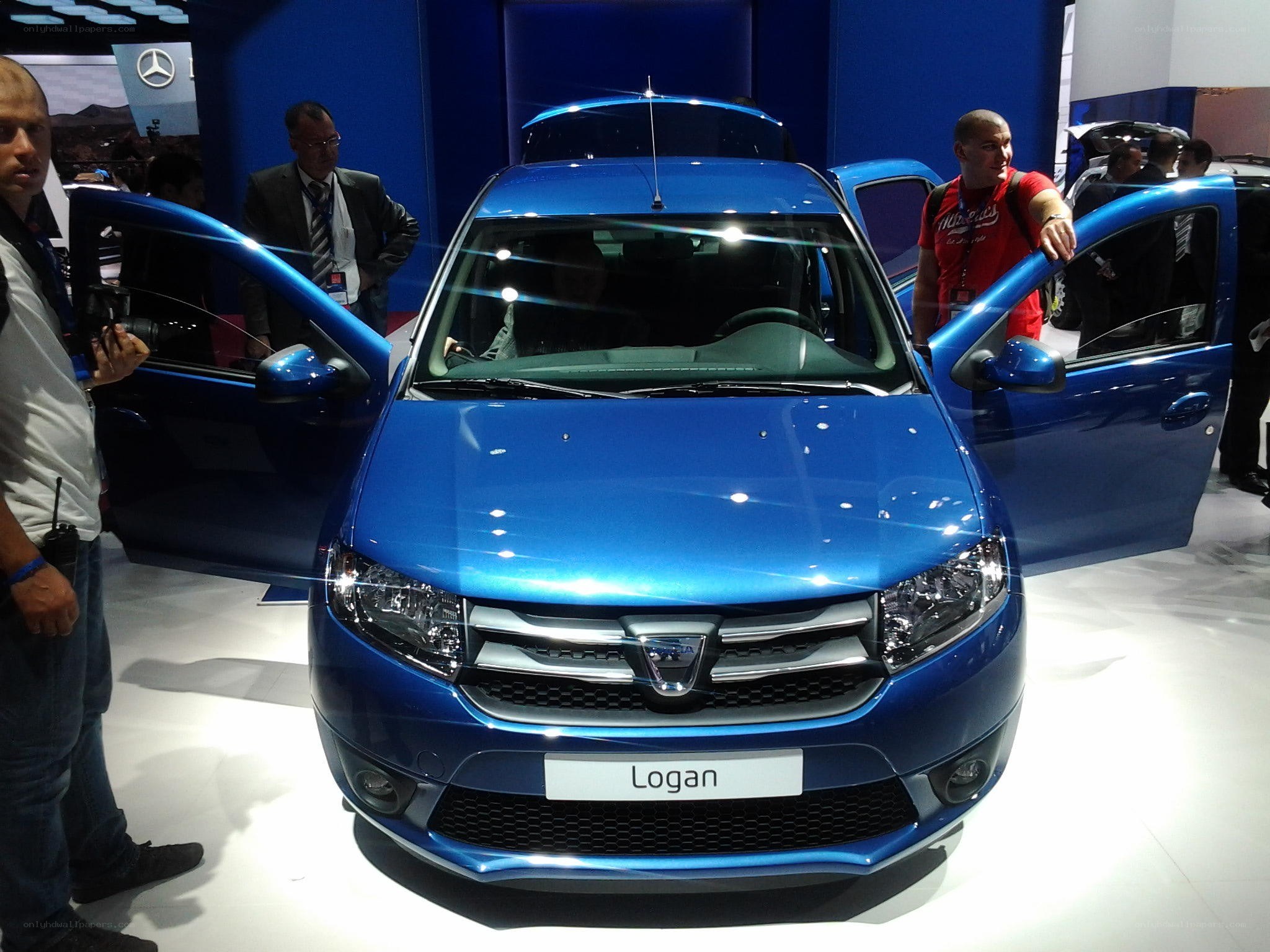 Blue Dacia Logan at auto show