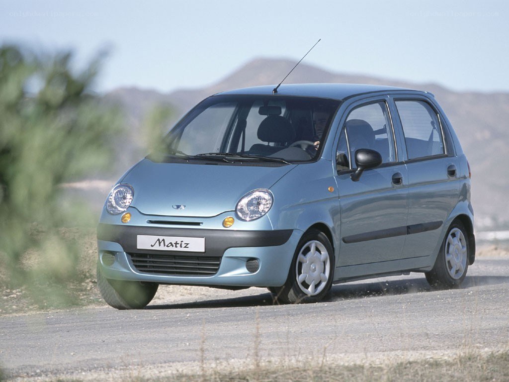 Blue Daewoo Matiz on a road
