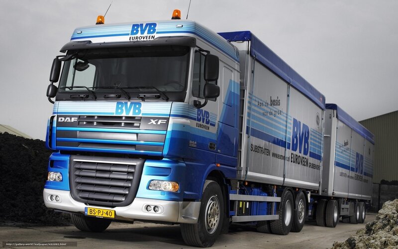 Blue DAF XF truck with trailers