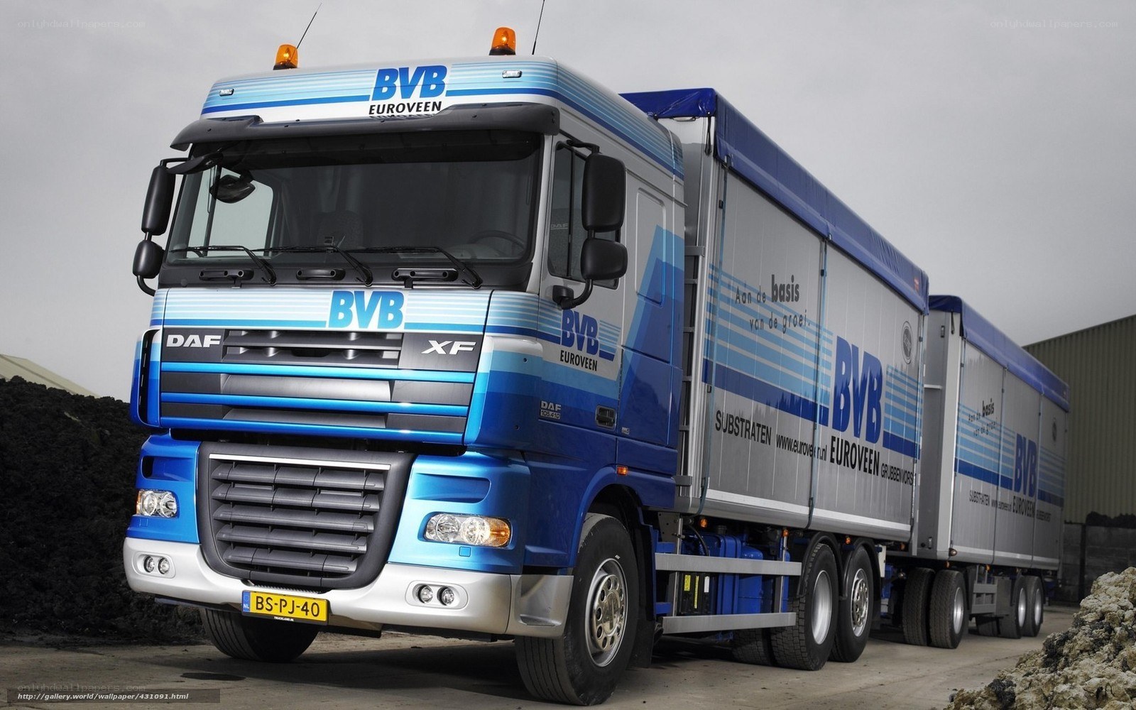Blue DAF XF truck with trailers