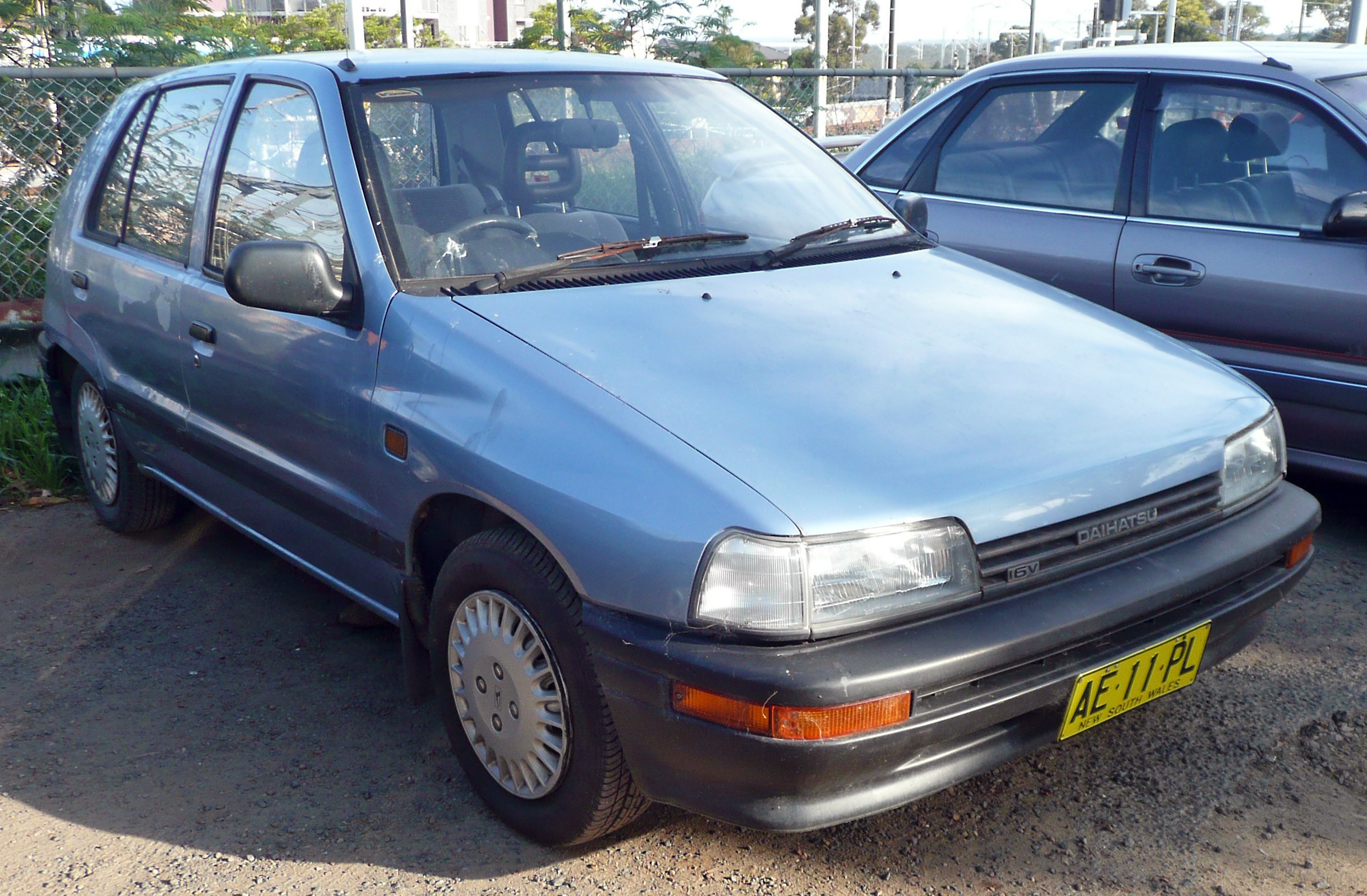 blue daihatsu car parked