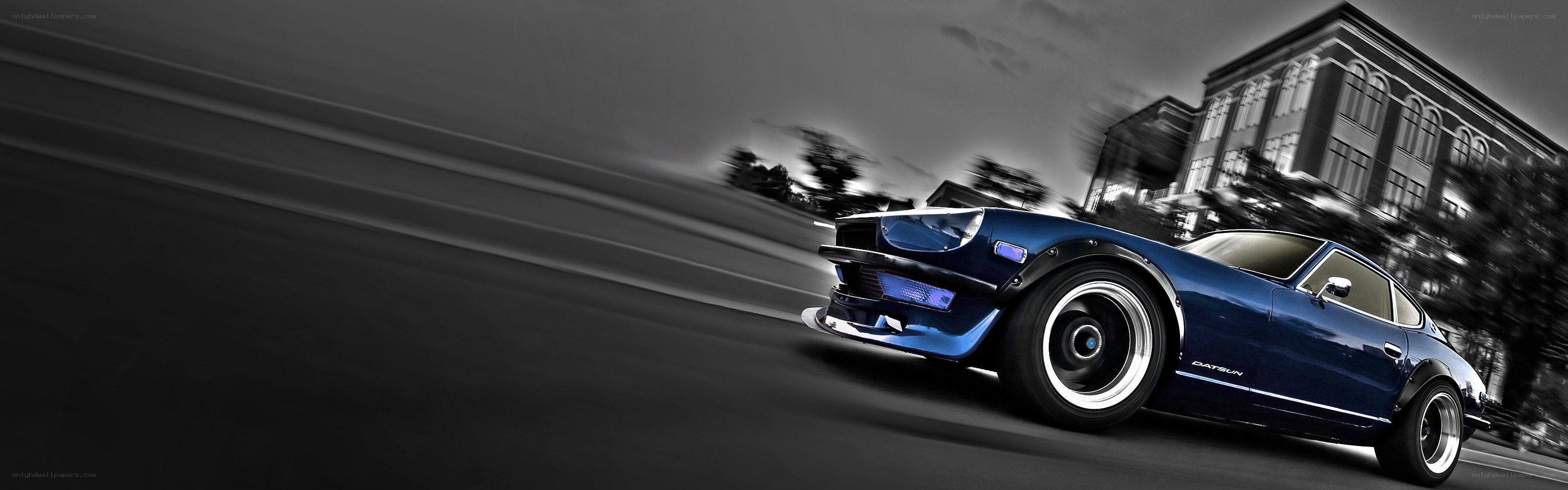 Blue Datsun car in motion
