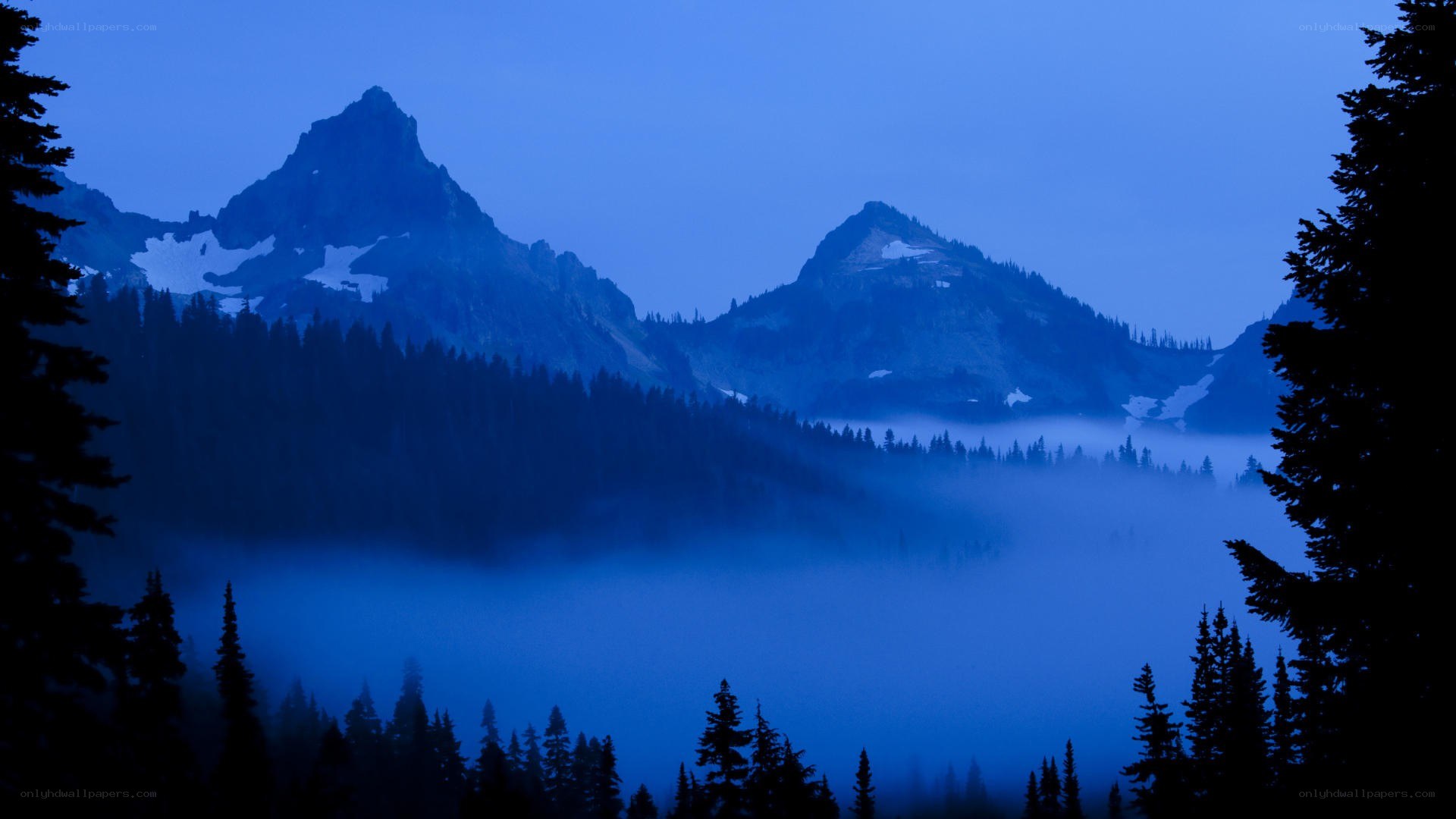 Blue dawn over mountain peaks
