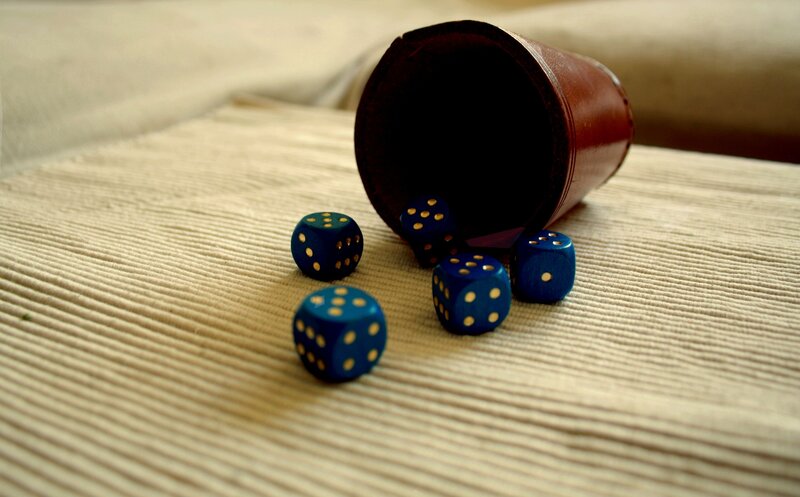 Blue dice on a textured surface