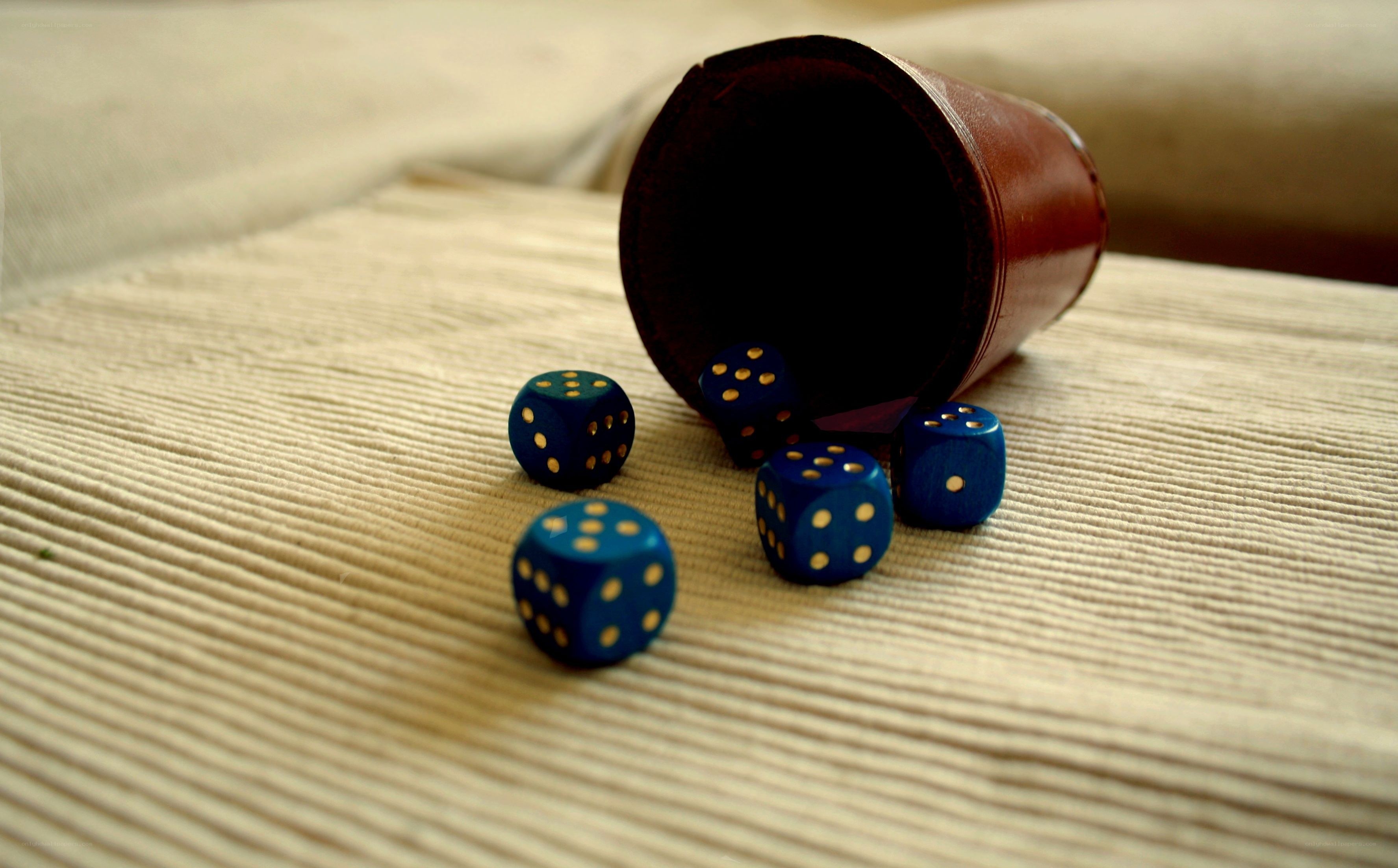 Blue dice on a textured surface