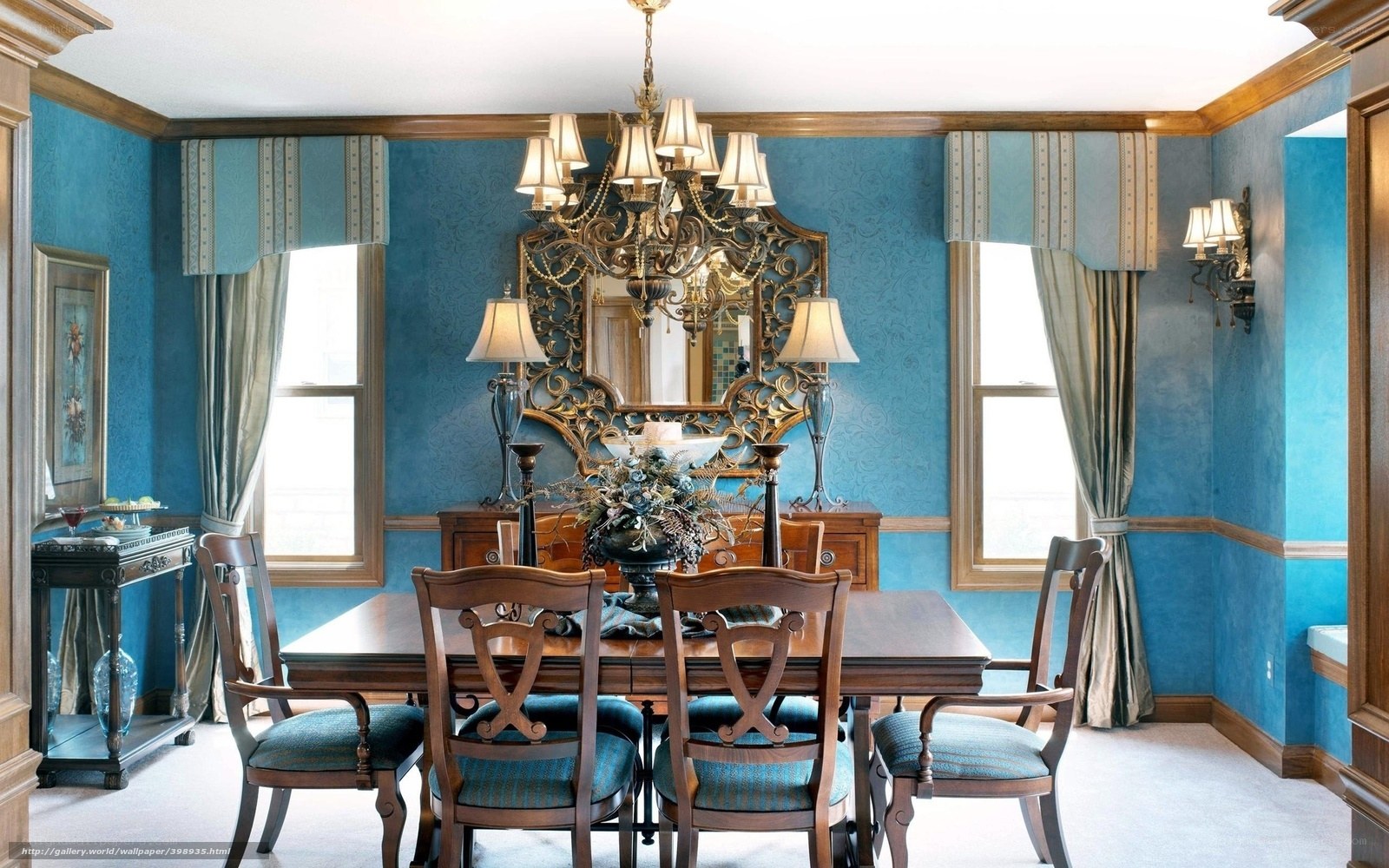 blue dining room with chandelier
