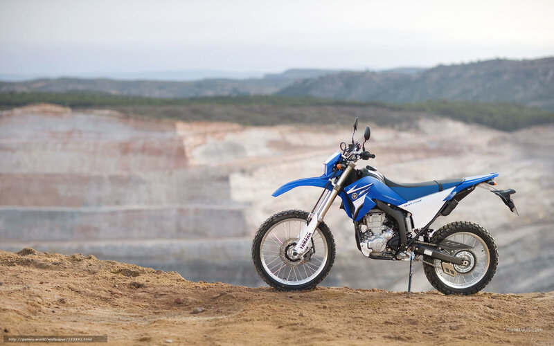 Blue dirt bike on a hill
