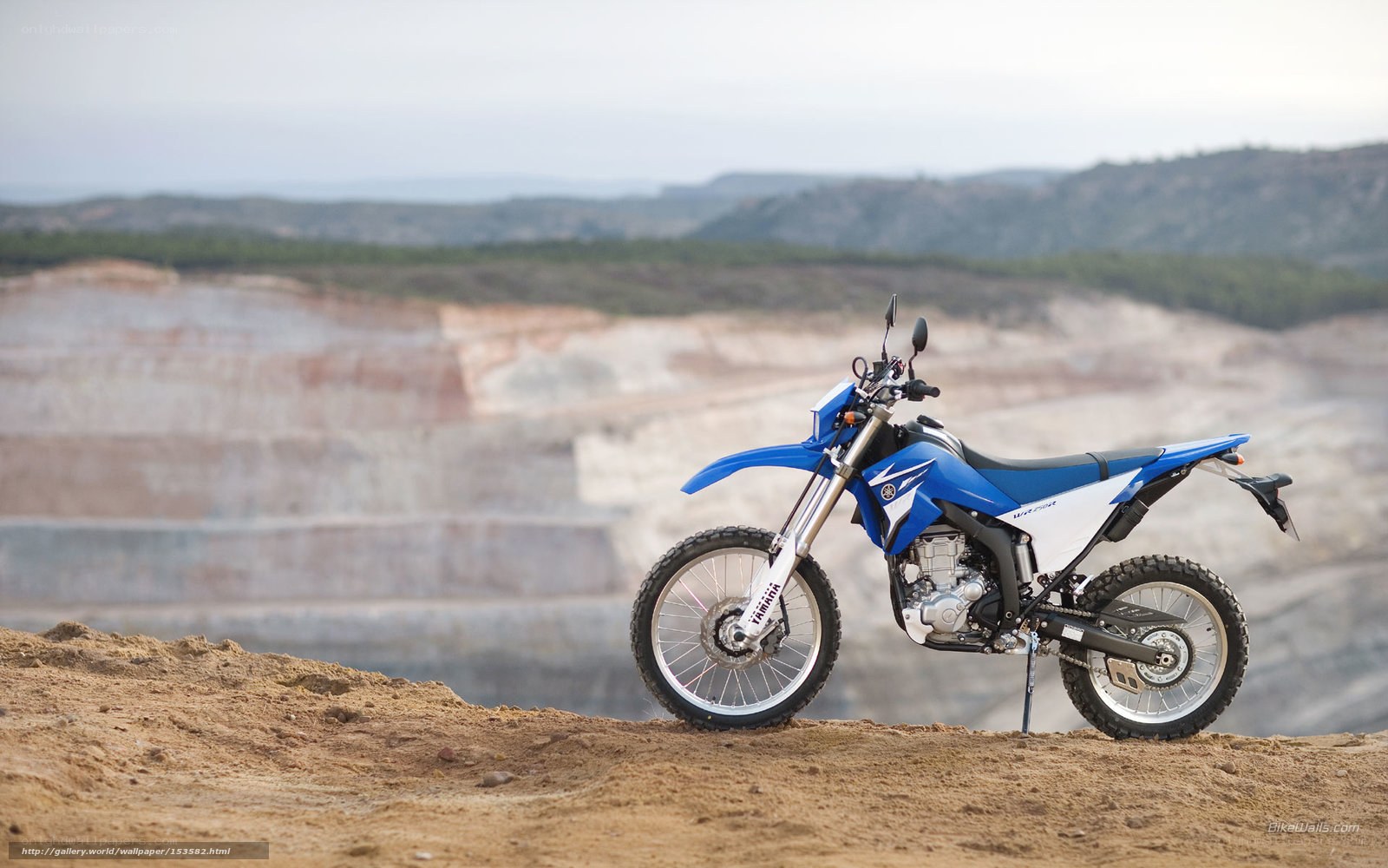 Blue dirt bike on a hill