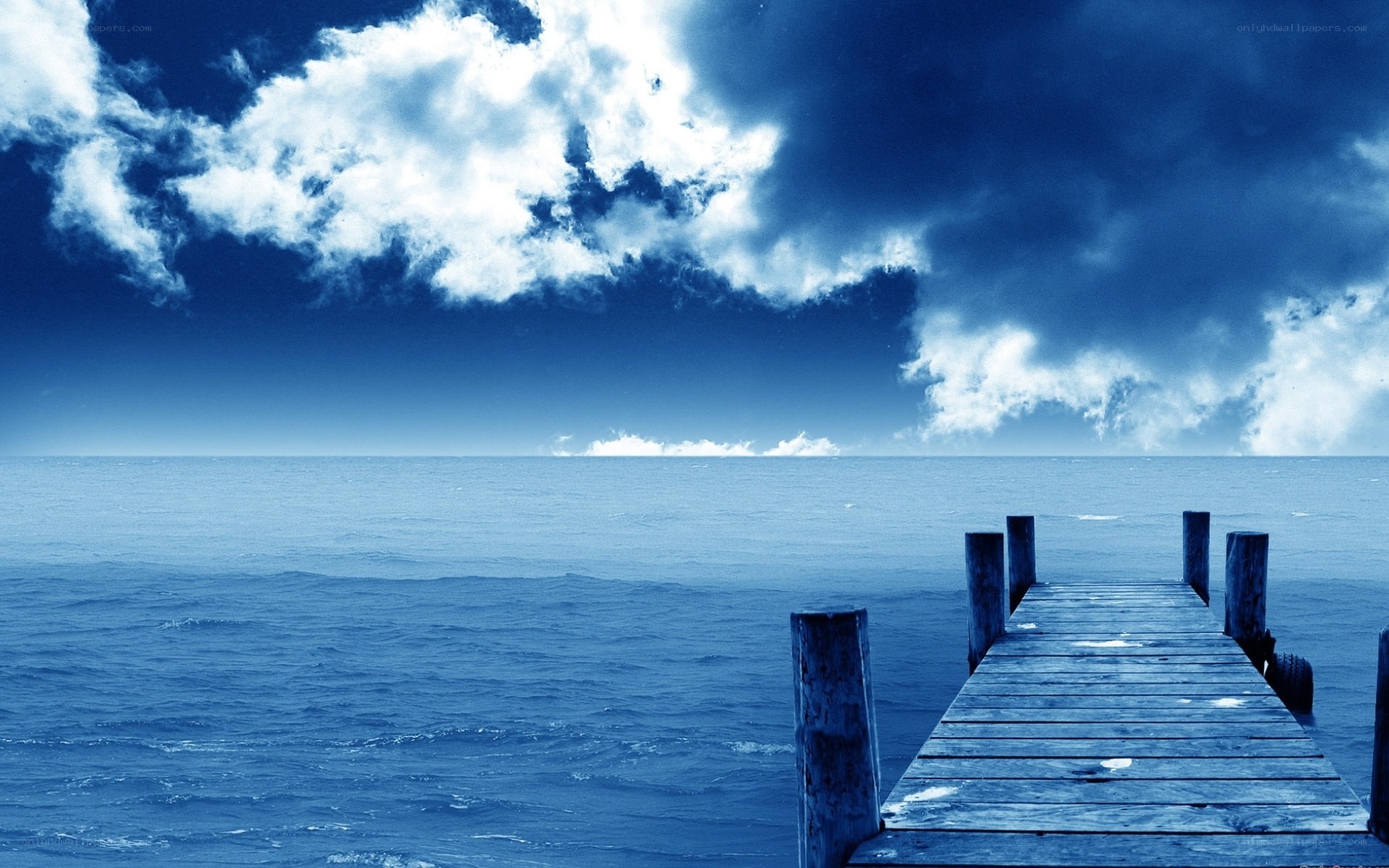 Blue dock over calm sea