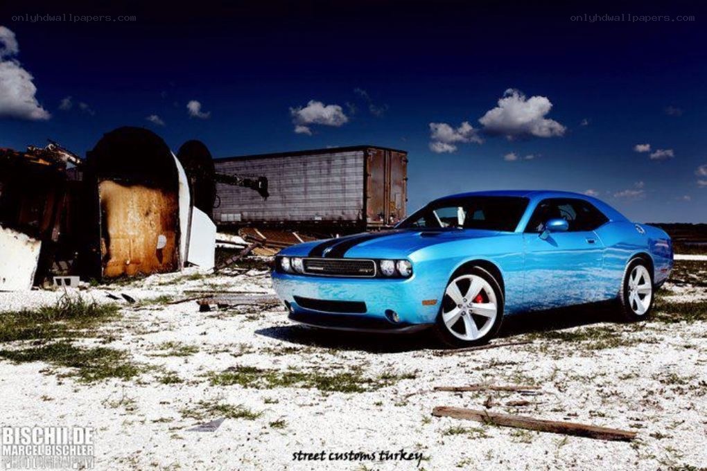 Blue Dodge Challenger in junkyard